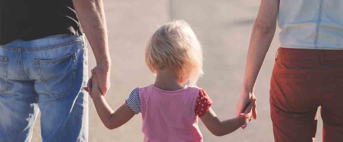 girl walking with her family