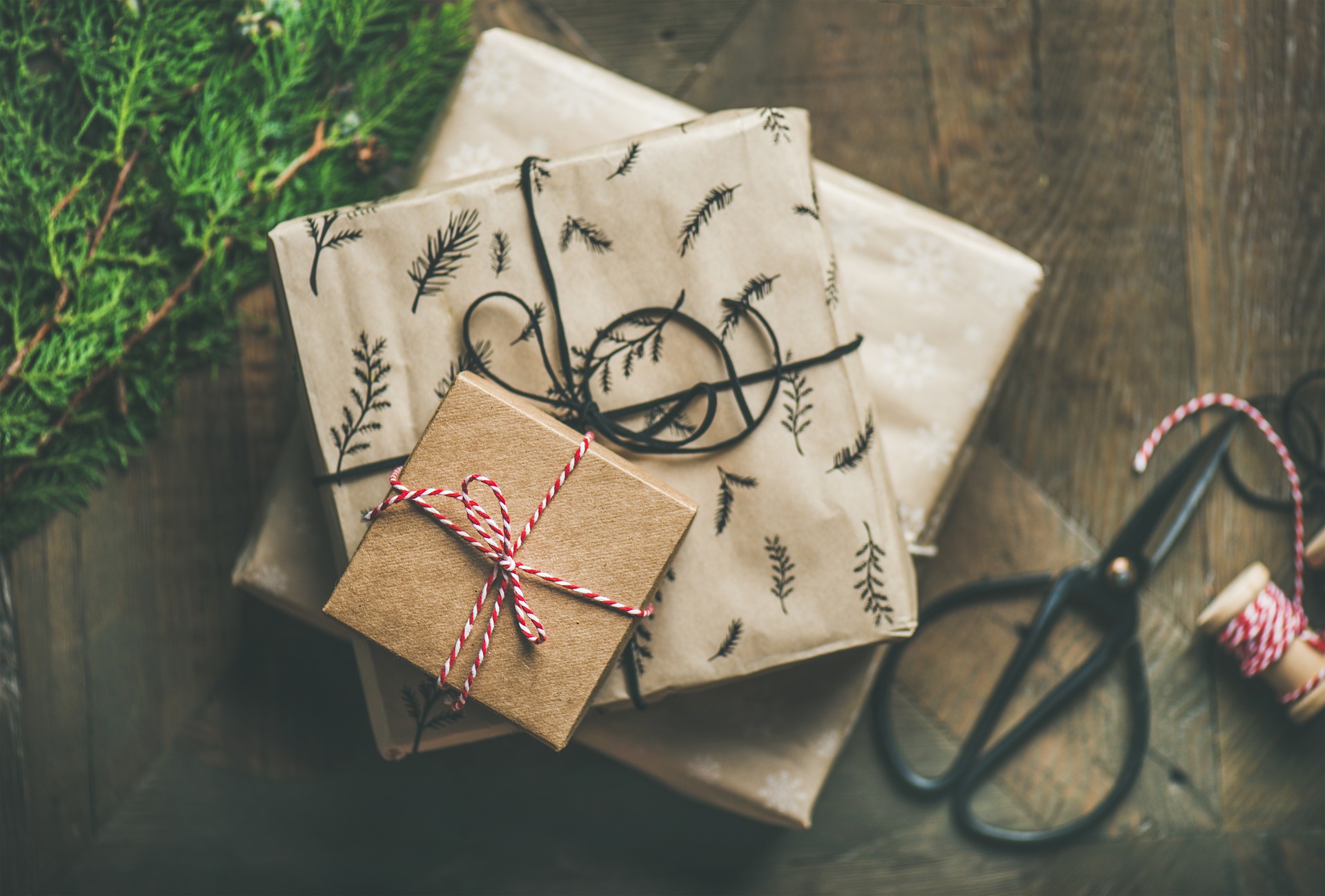 3 wrapped gifts stacked on top of each other