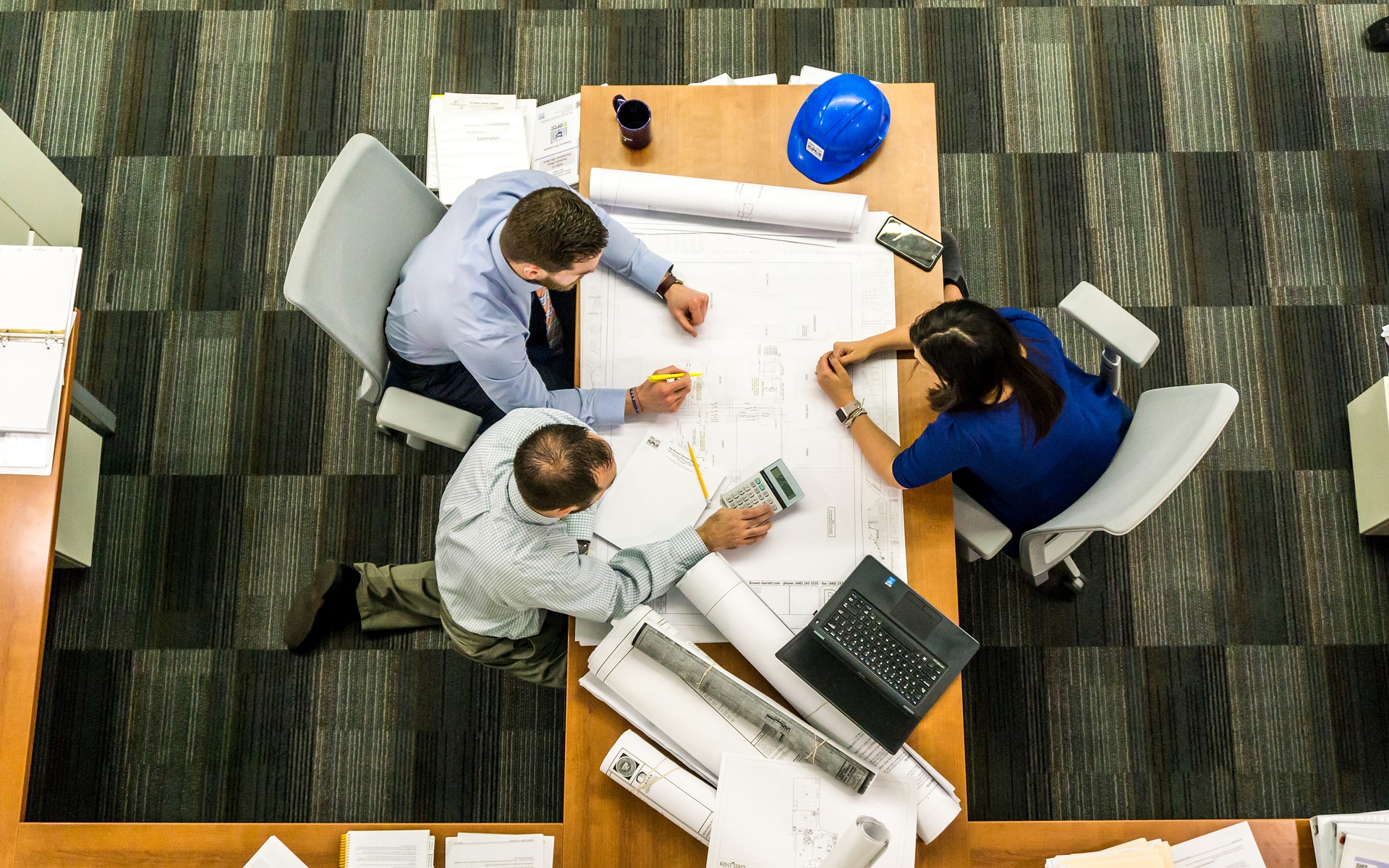 Workers drafting ideas at a table